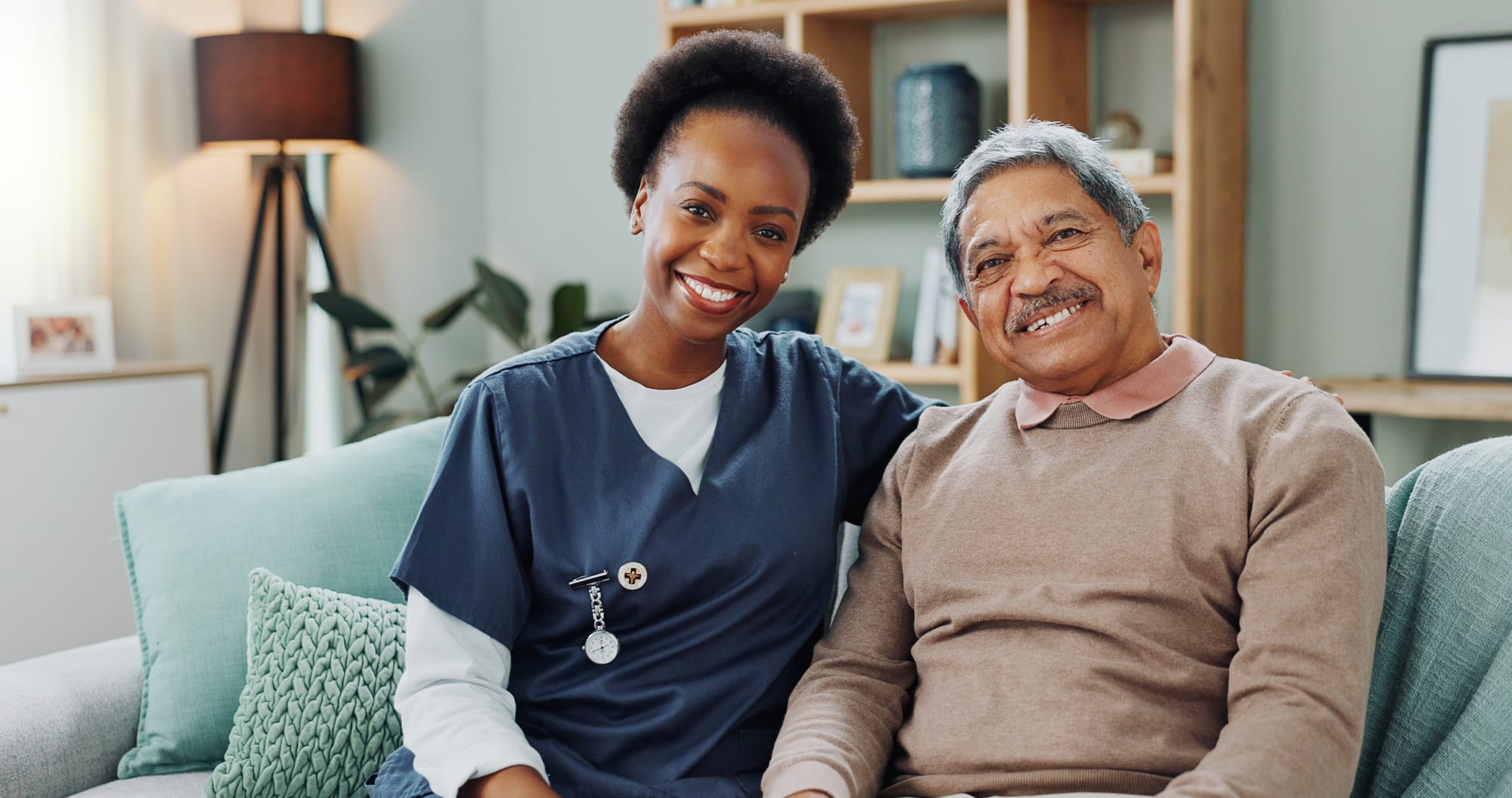 Caregiver smiling with elderly resident at Cottonwood